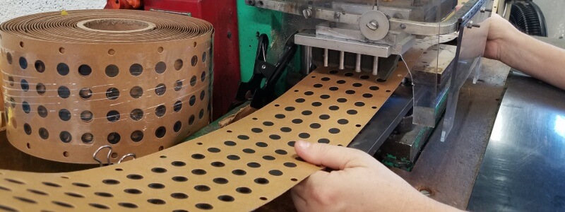Custom die cut gaskets using our punch press machine.