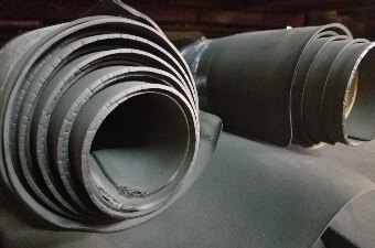A picture of two rolls of black closed-cell foam